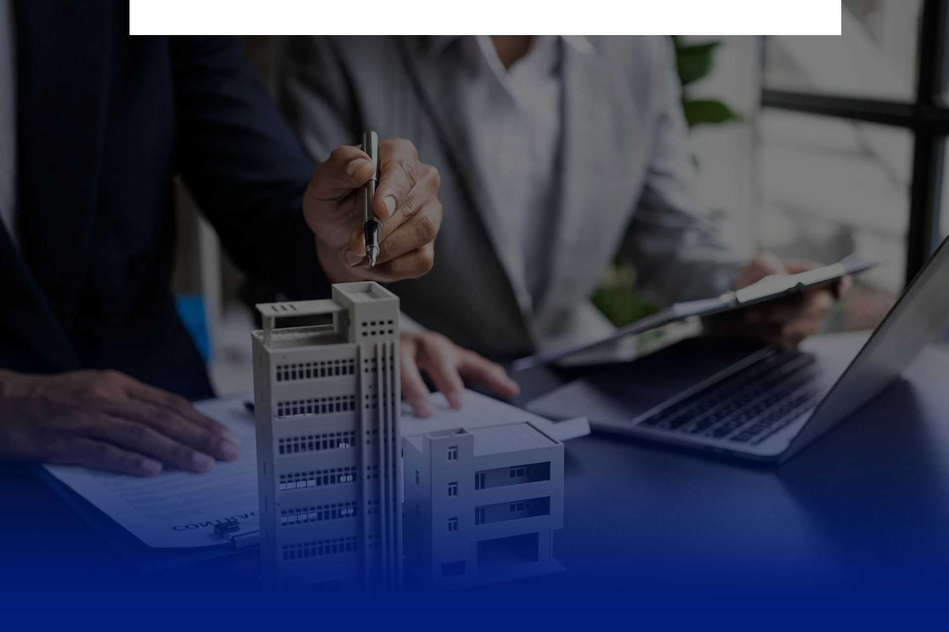 Commercial buildings and a handshake representing business insurance