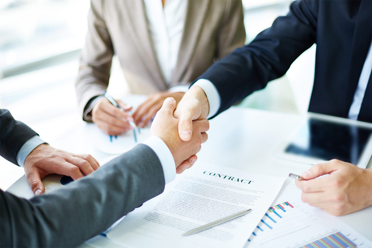 Insurance agent shaking hands with a client